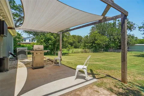 a view of a swimming pool with a patio