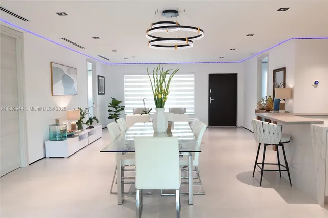 a view of a dining room with furniture window and outside view