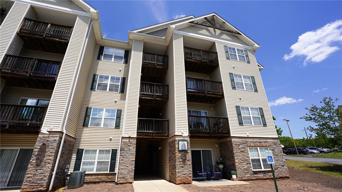 303 Lookover Drive Anderson, SC 29621 - Photo 1 of 46 This modern multi-story complex features private balconies and classic window shutters, blending comfort with timeless design.