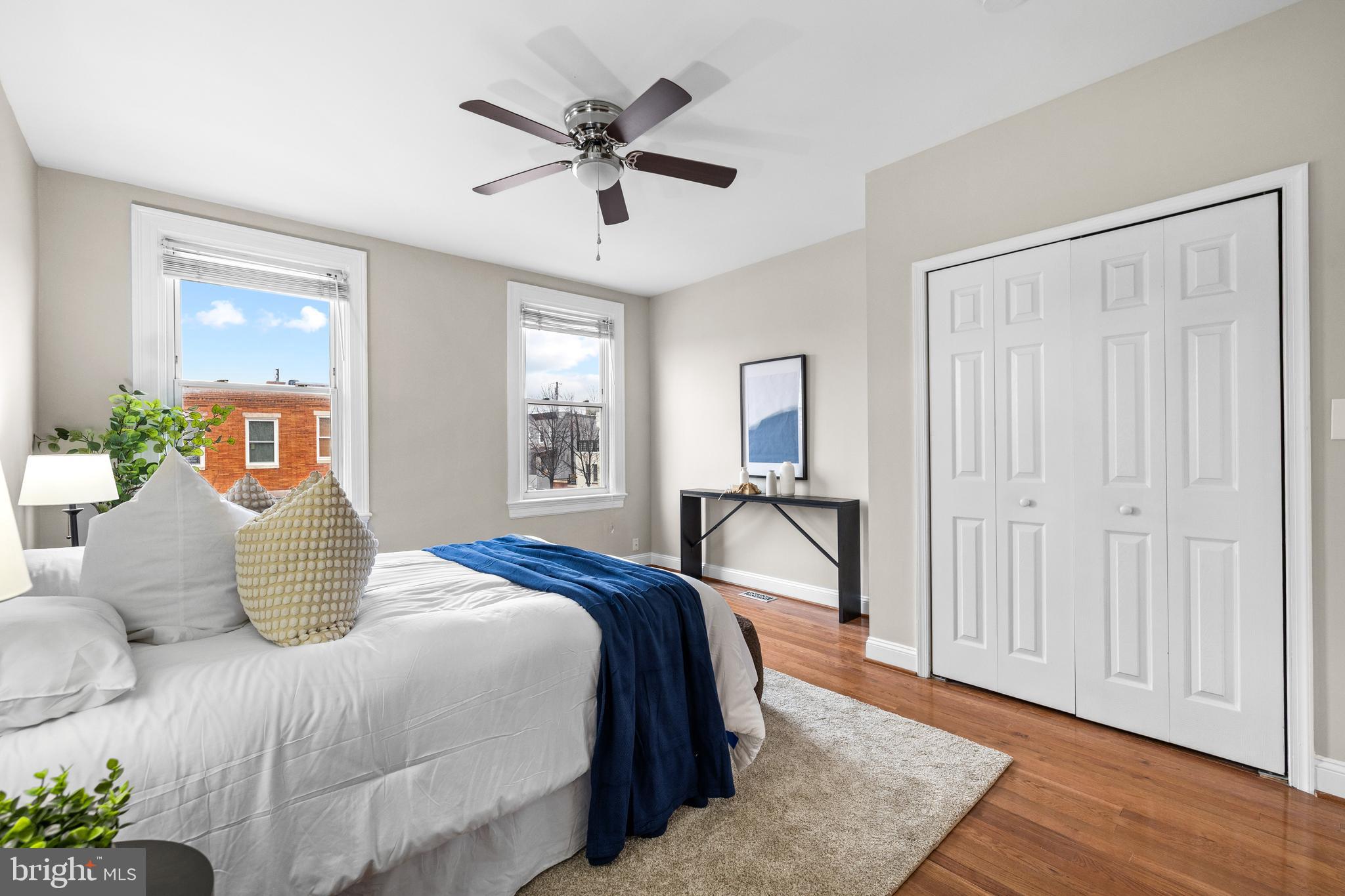 3702 Foster Avenue Baltimore, MD 21224 - Photo 19 of 39 a bedroom with a large bed and a chandelier