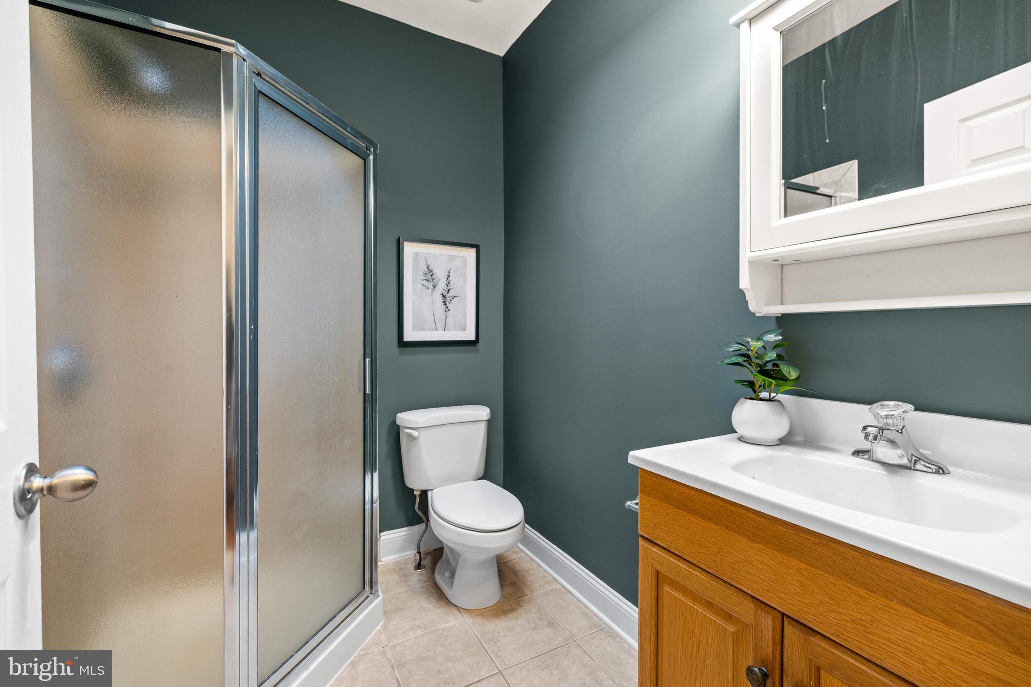 3702 Foster Avenue Baltimore, MD 21224 - Photo 23 of 39 a bathroom with a toilet sink and mirror