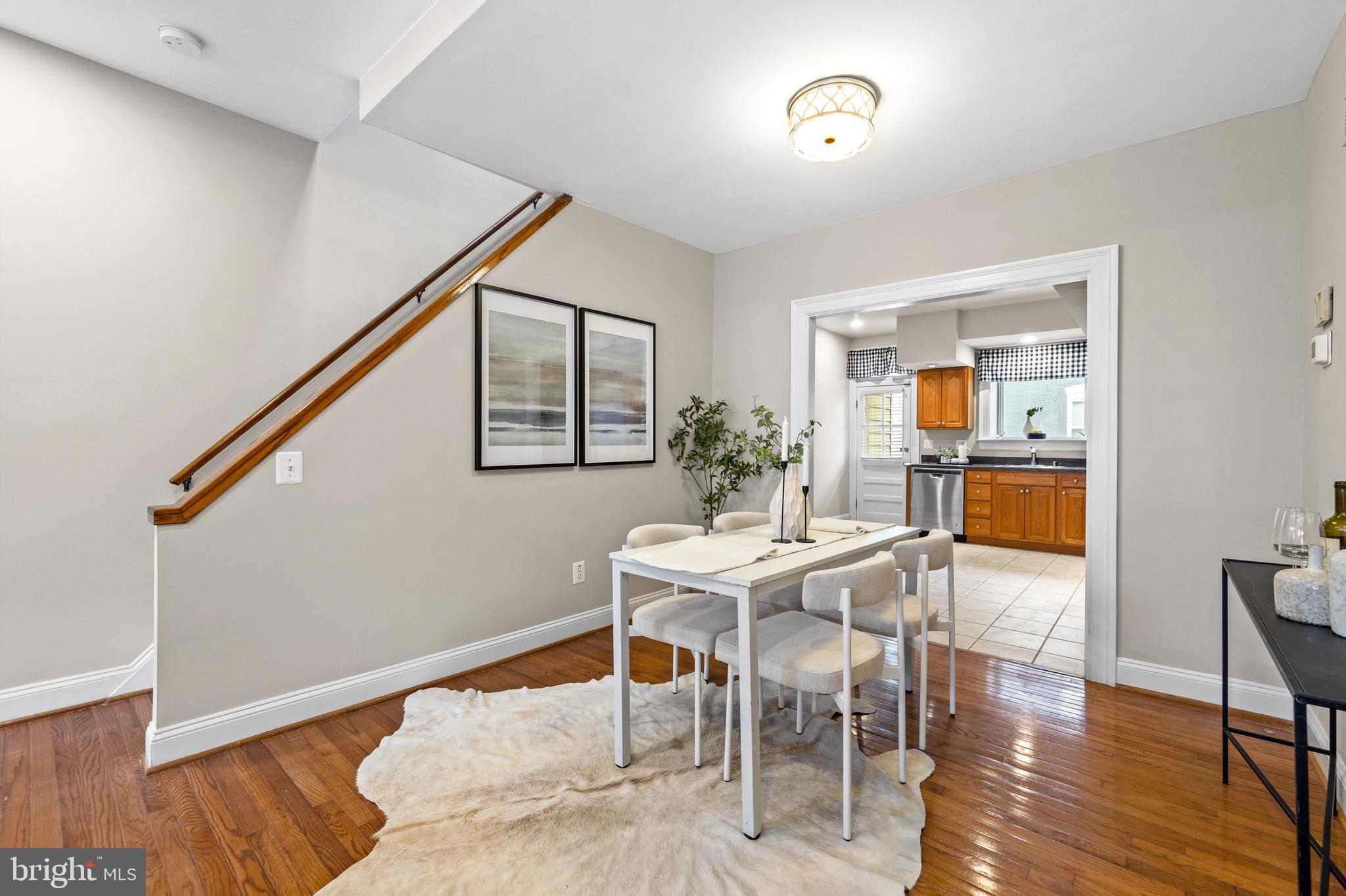 3702 Foster Avenue Baltimore, MD 21224 - Photo 8 of 39 a dining room with furniture and wooden floor