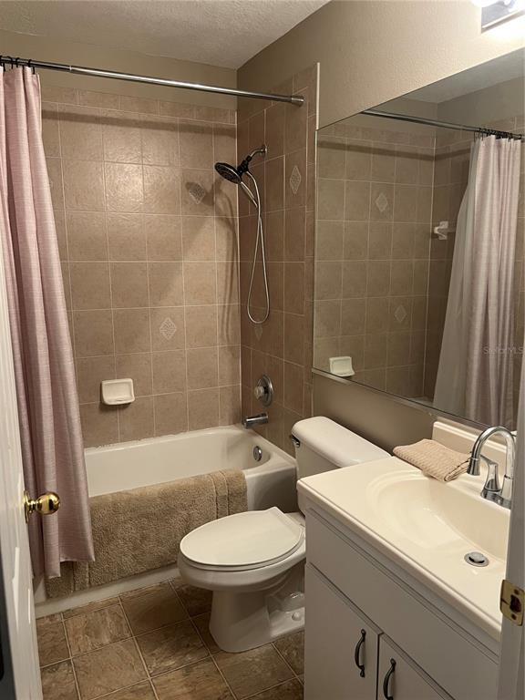 3803 Herlong Street New Port Richey, FL 34655 - Photo 11 of 22 a bathroom with a sink a toilet and shower