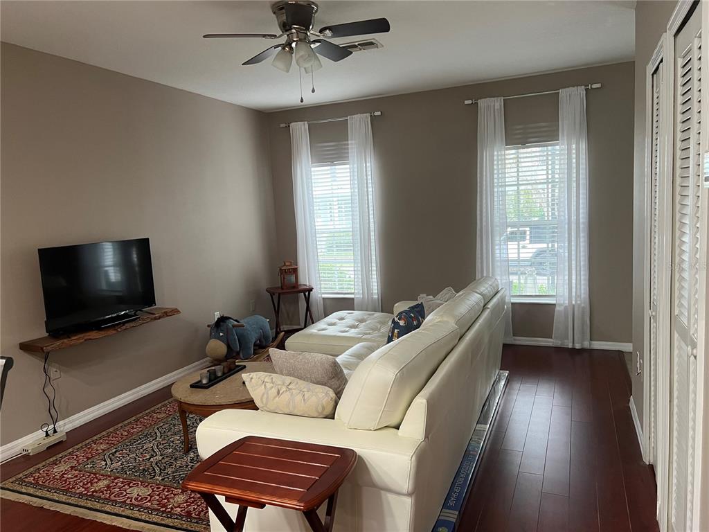 3803 Herlong Street New Port Richey, FL 34655 - Photo 5 of 22 a living room with furniture and a flat screen tv