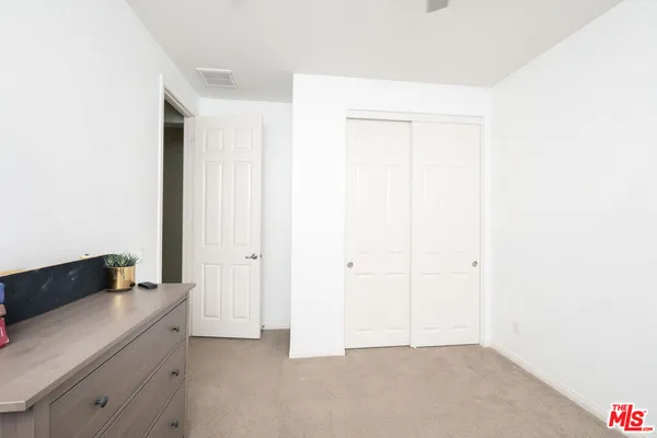 a bathroom with a double vanity sink toilet and shower
