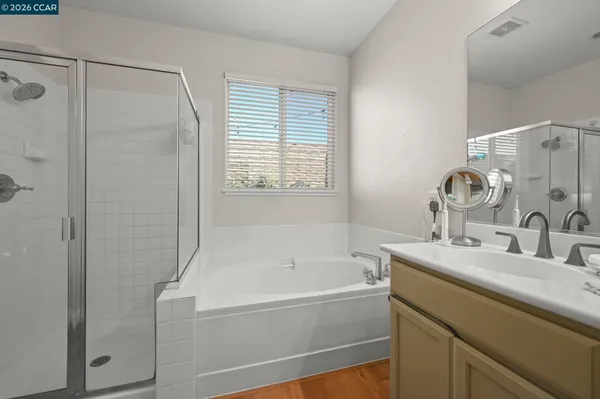 a white bath tub sitting next to a white sink