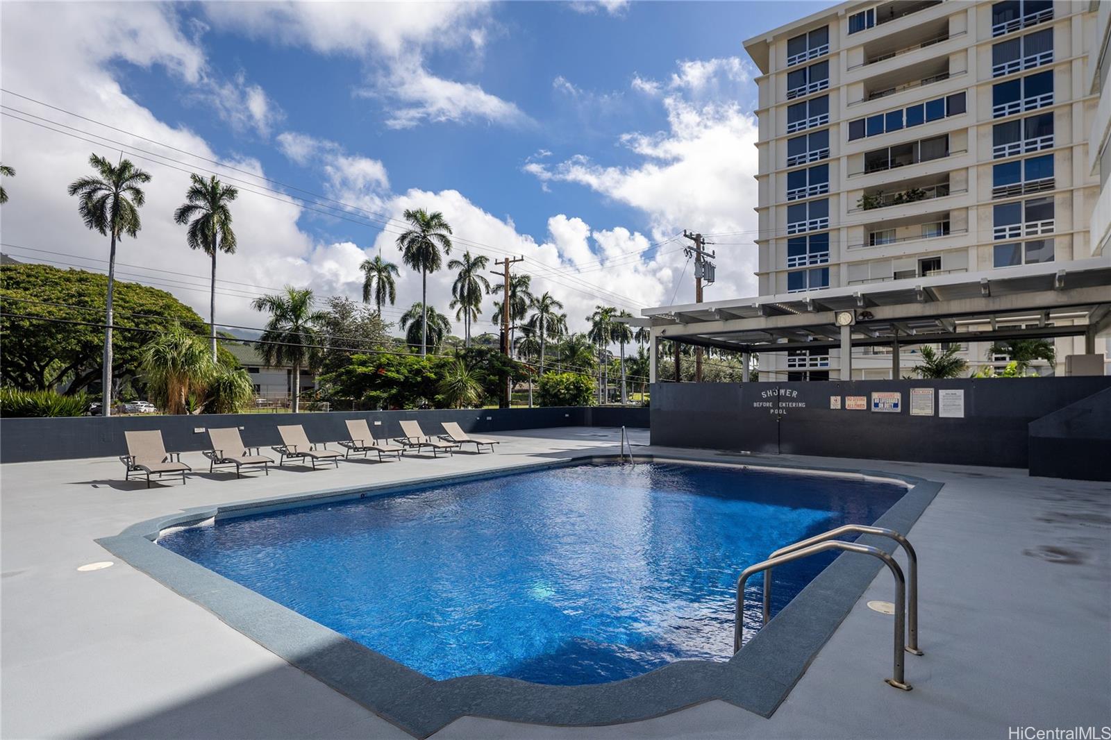 1615 Wilder Avenue, Unit 507 Honolulu, HI 96822 - Photo 18 of 20 a view of a swimming pool with outdoor seating