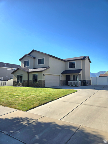 601 West 150 North, Unit 25 Springville, UT 84663 - Photo 1 of 29 Two-story residence featuring a neutral-toned stucco and stone facade