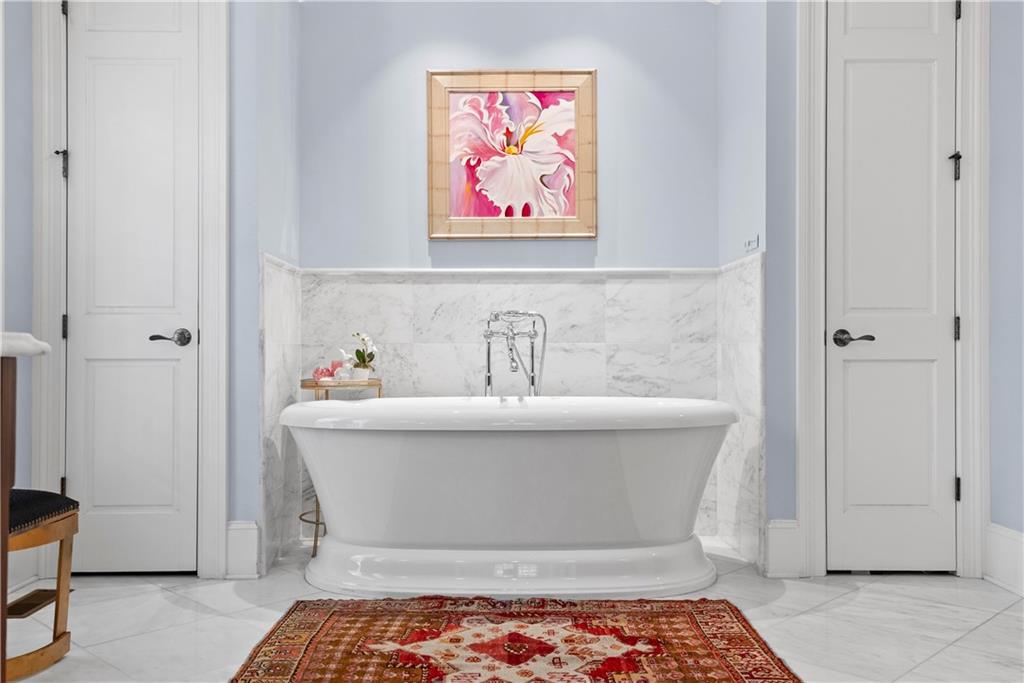 315 East Line Street Calhoun, GA 30701 - Photo 35 of 71 a bathroom with a bathtub and shower