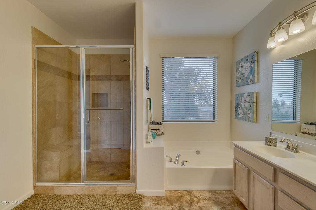 2803 West Lamar Road Phoenix, AZ 85017 - Photo 26 of 47 a bathroom with a tub sink and shower