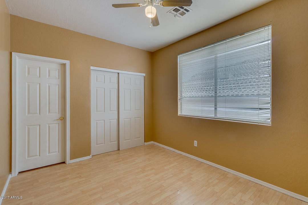 2803 West Lamar Road Phoenix, AZ 85017 - Photo 33 of 47 a view of an empty room with a window