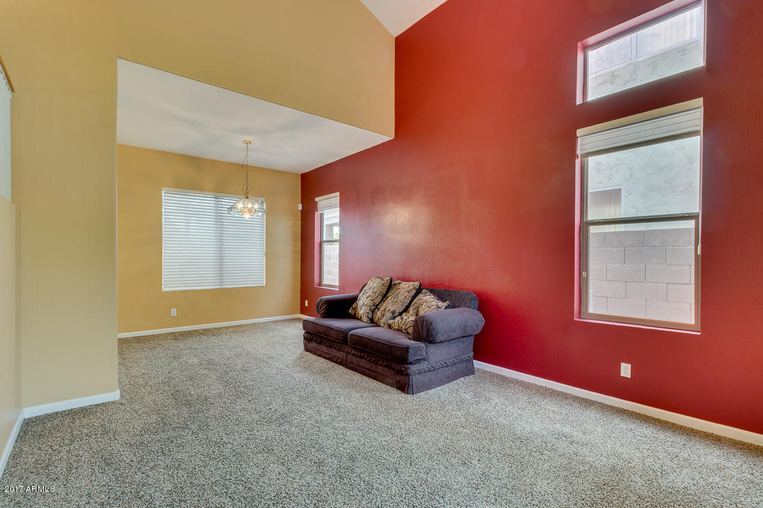 2803 West Lamar Road Phoenix, AZ 85017 - Photo 4 of 47 an empty room with windows and cabinet