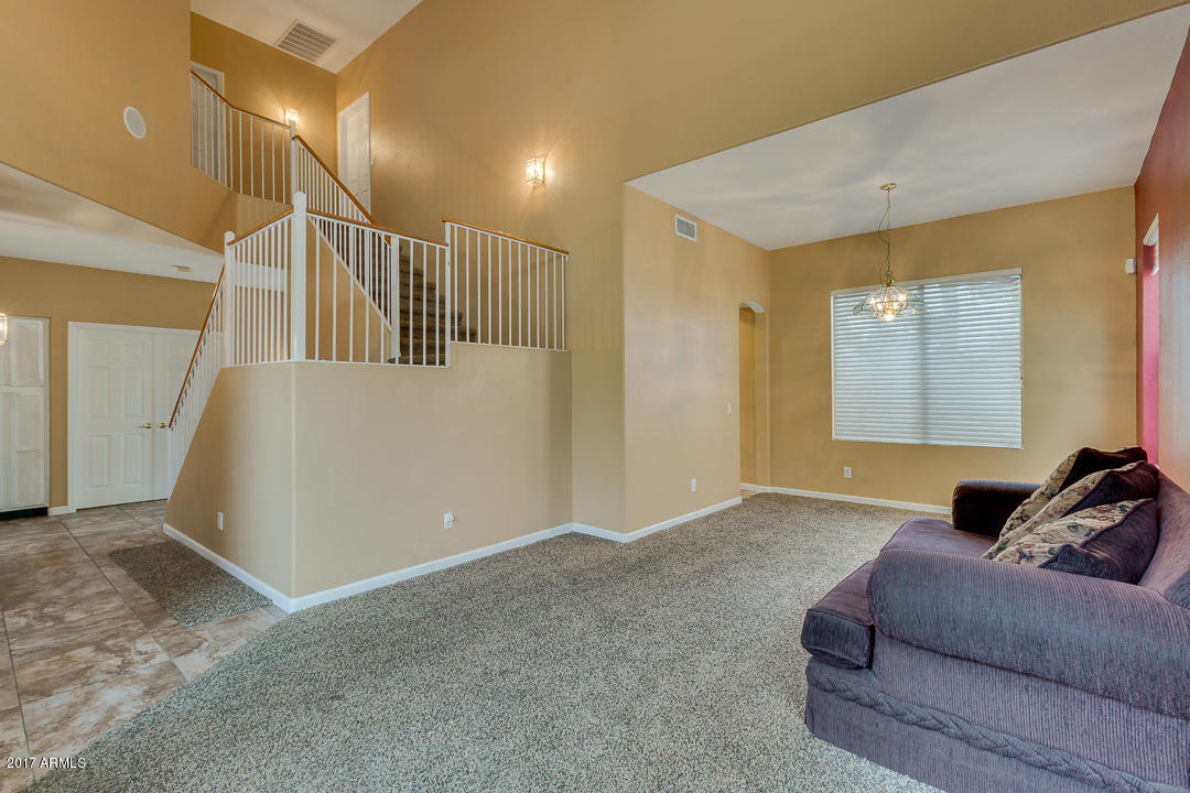 2803 West Lamar Road Phoenix, AZ 85017 - Photo 5 of 47 a living room with furniture and a window