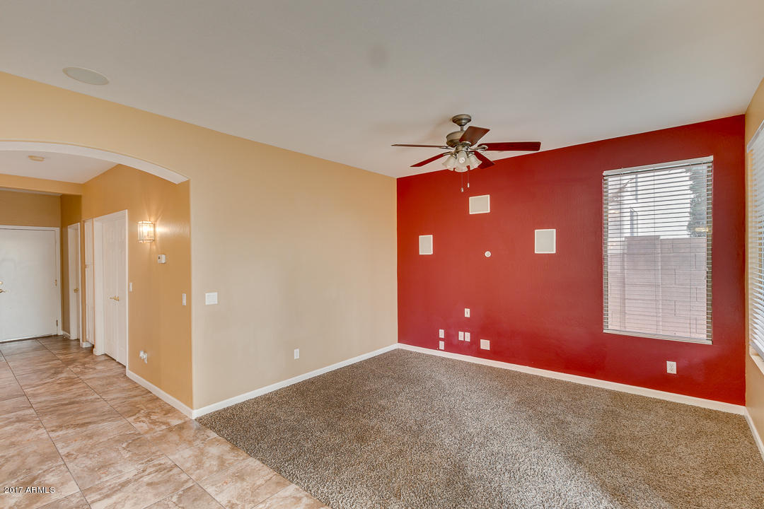2803 West Lamar Road Phoenix, AZ 85017 - Photo 9 of 47 a view of a livingroom with a ceiling fan and window