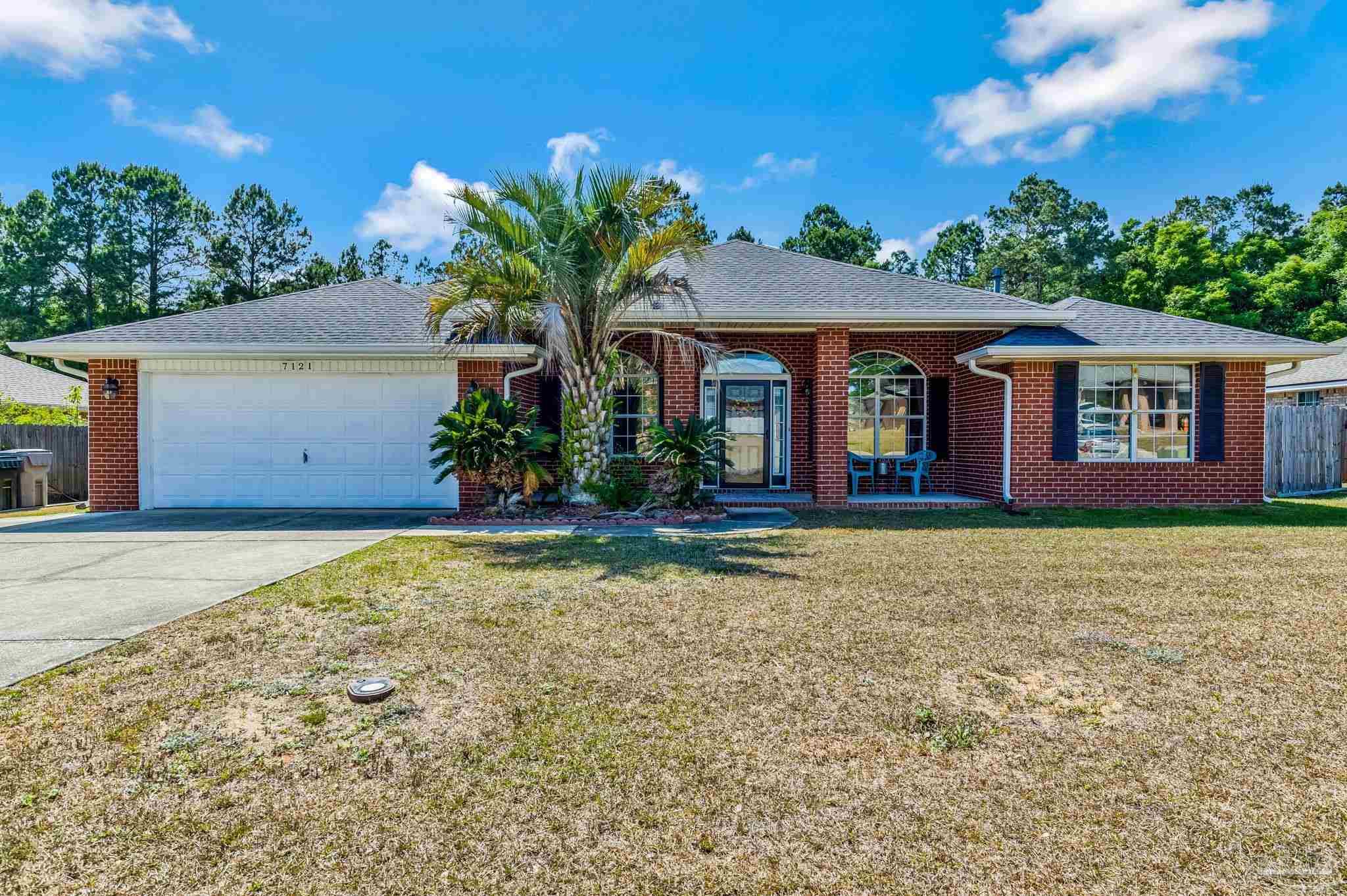 7121 Woodside Road Pensacola, FL 32526 - Photo 1 of 69 front view of a house with a yard