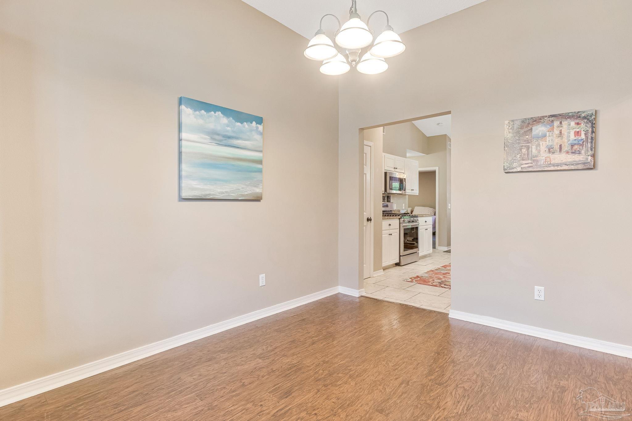 7121 Woodside Road Pensacola, FL 32526 - Photo 17 of 69 a view of an empty room with a window