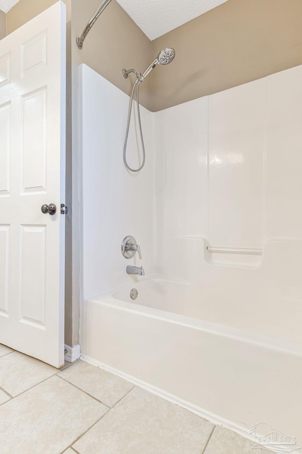 7121 Woodside Road Pensacola, FL 32526 - Photo 37 of 69 a bathroom with a bathtub and a shower