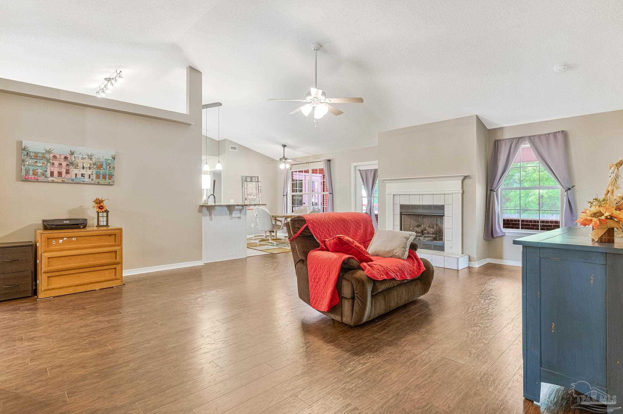 7121 Woodside Road Pensacola, FL 32526 - Photo 5 of 69 a living room with furniture fireplace and window