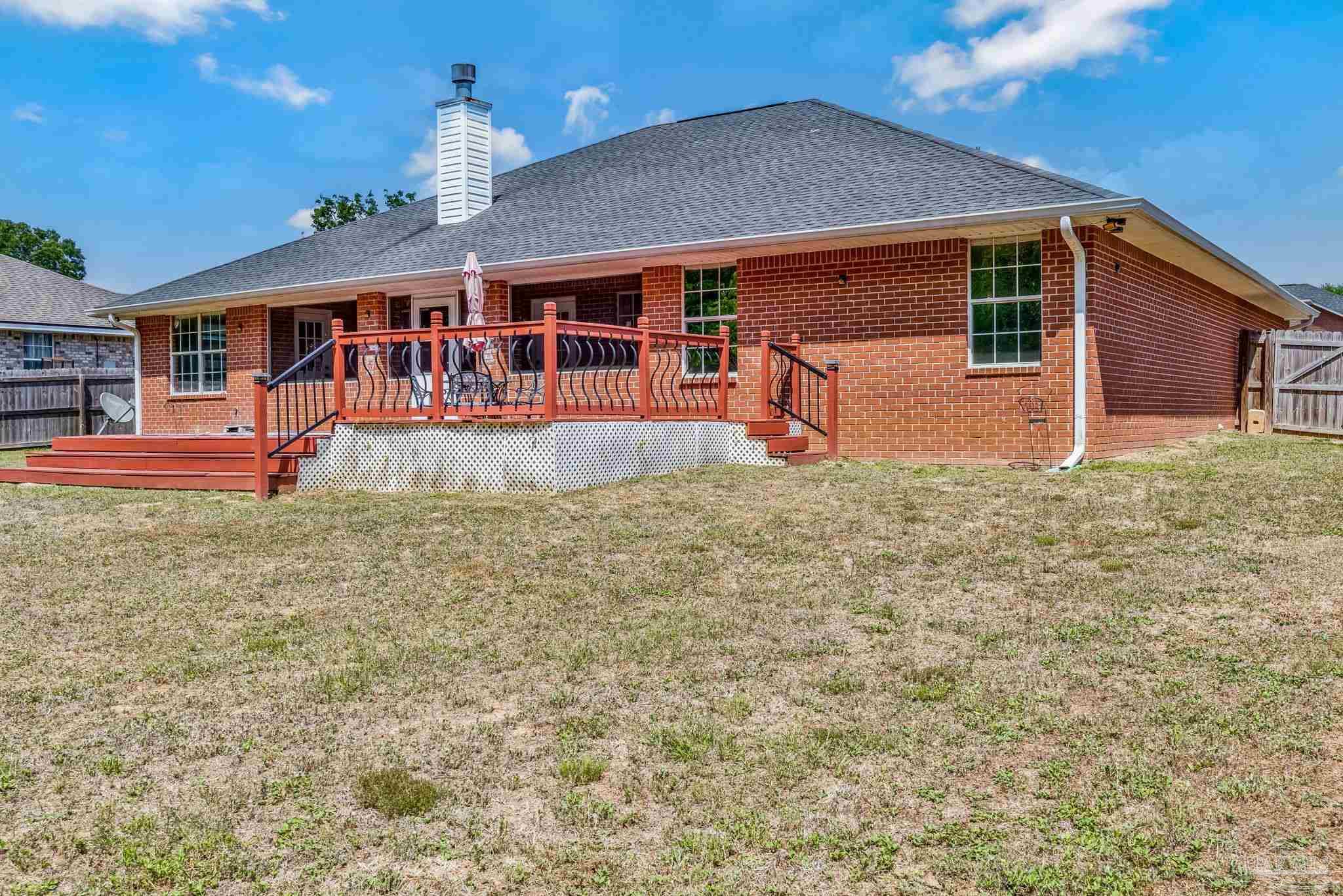 7121 Woodside Road Pensacola, FL 32526 - Photo 52 of 69 a front view of a house with a yard