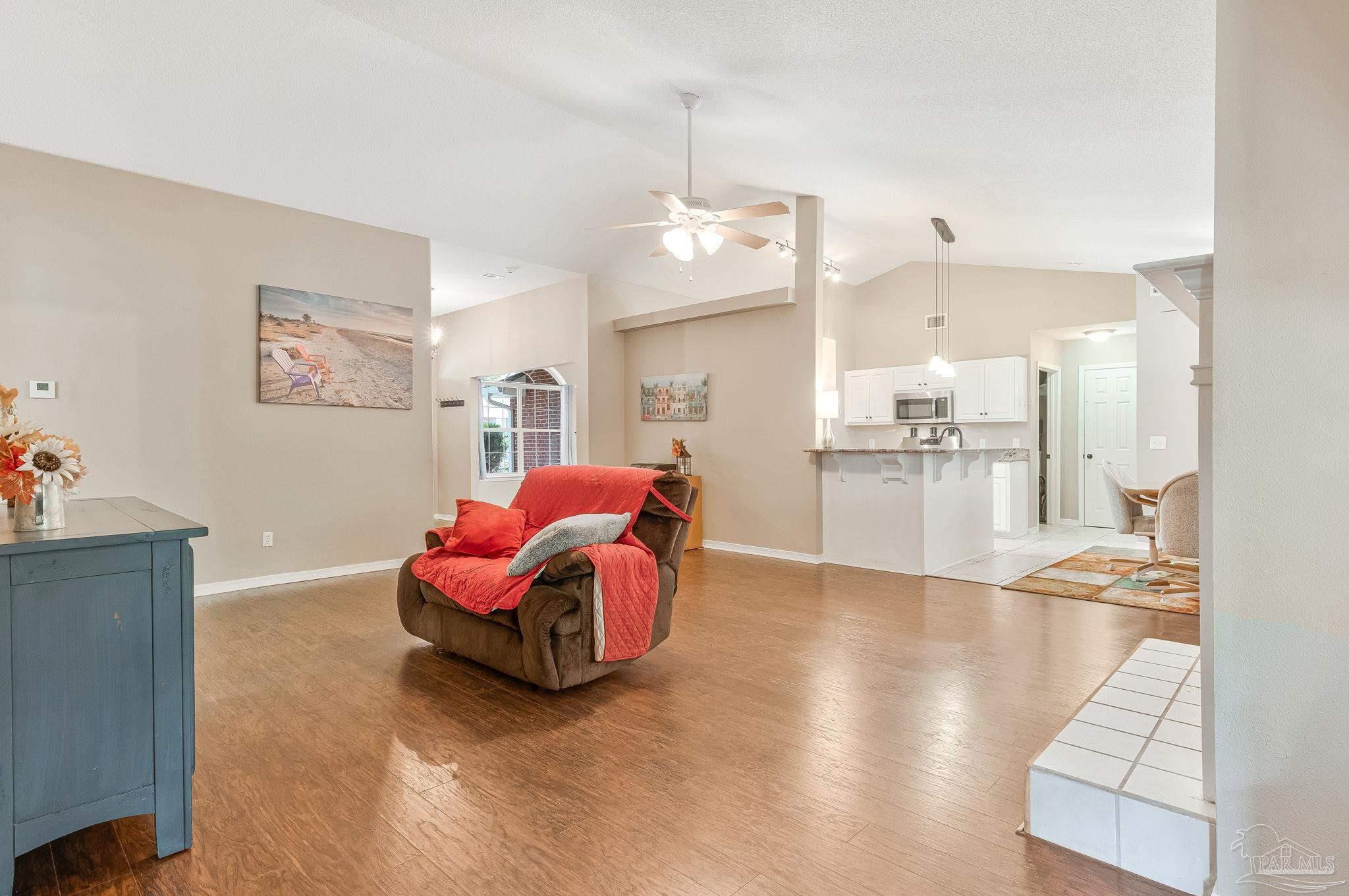 7121 Woodside Road Pensacola, FL 32526 - Photo 8 of 69 a living room with furniture and kitchen view