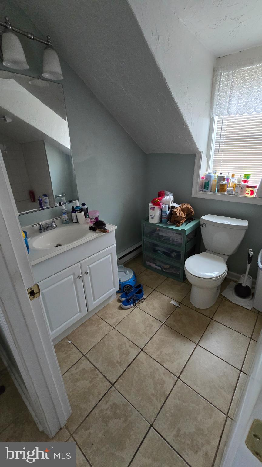 327 North Main Street York, PA 17403 - Photo 7 of 12 a bathroom with a sink toilet and a mirror