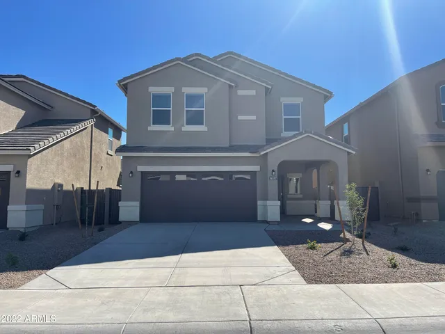 a front view of a house with yard