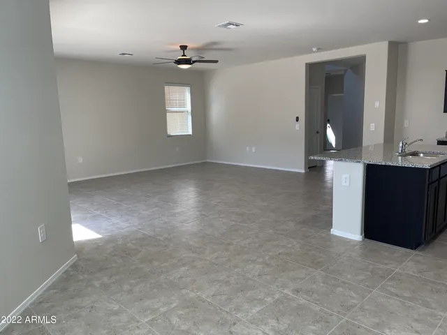wooden floor in an empty room and a window