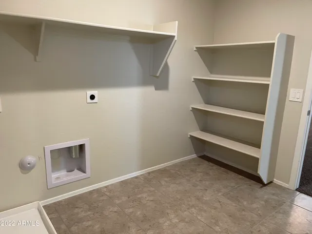 a view of an empty walk in closet