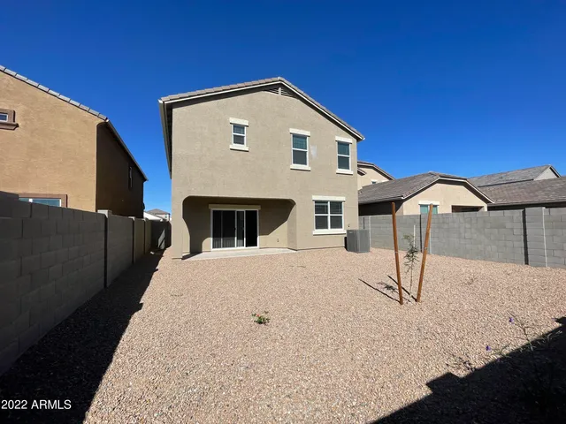 a front view of a house with parking space