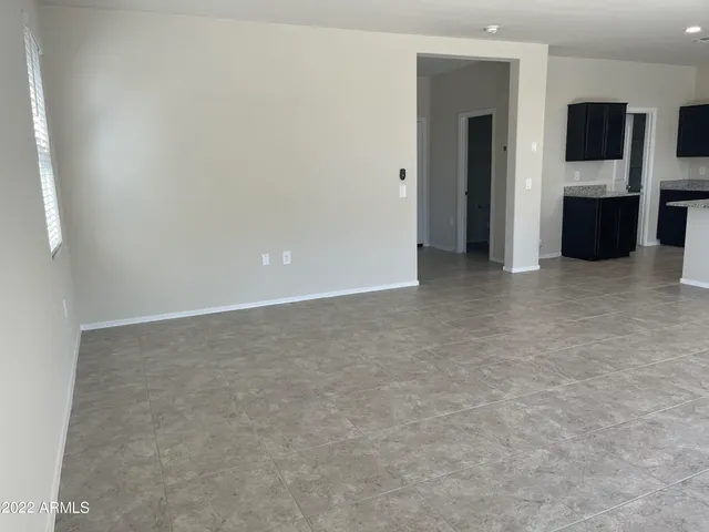 an empty room with entrance door