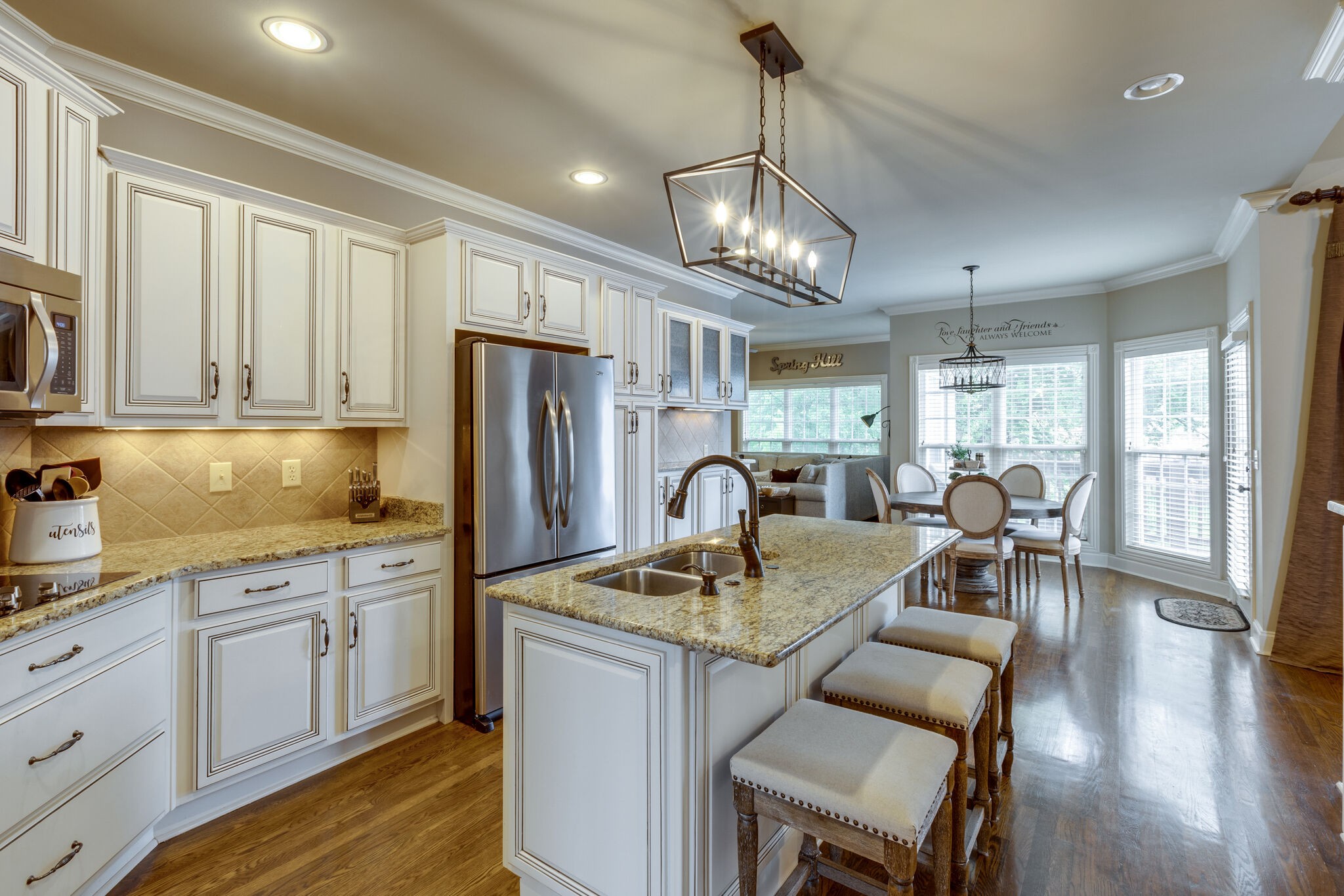 3012 Stewart Campbell Pointe Spring Hill, TN 37174 - Photo 15 of 44 a view of dining table chairs and chandelier