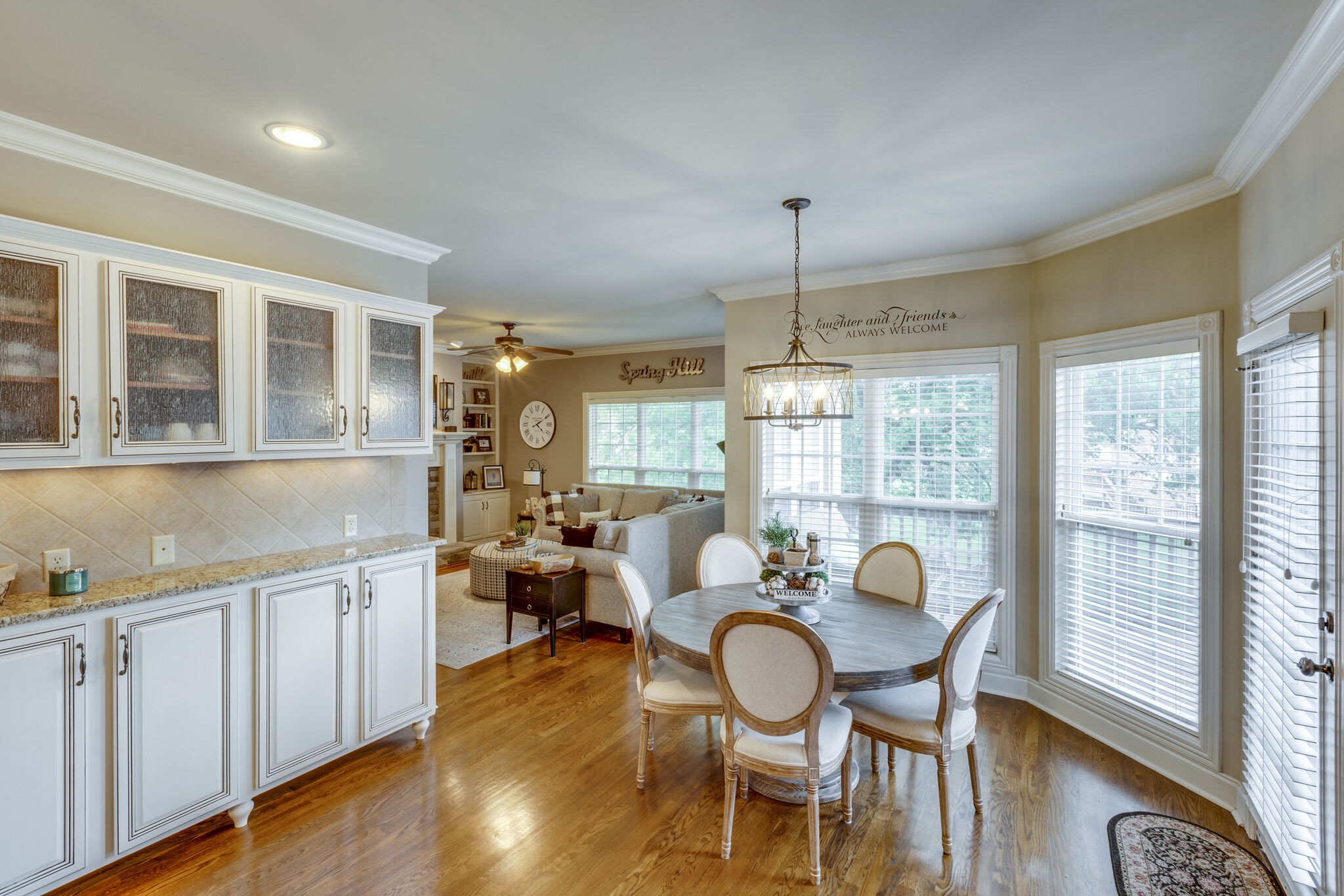 3012 Stewart Campbell Pointe Spring Hill, TN 37174 - Photo 16 of 44 a view of a dining room with furniture window and wooden floor