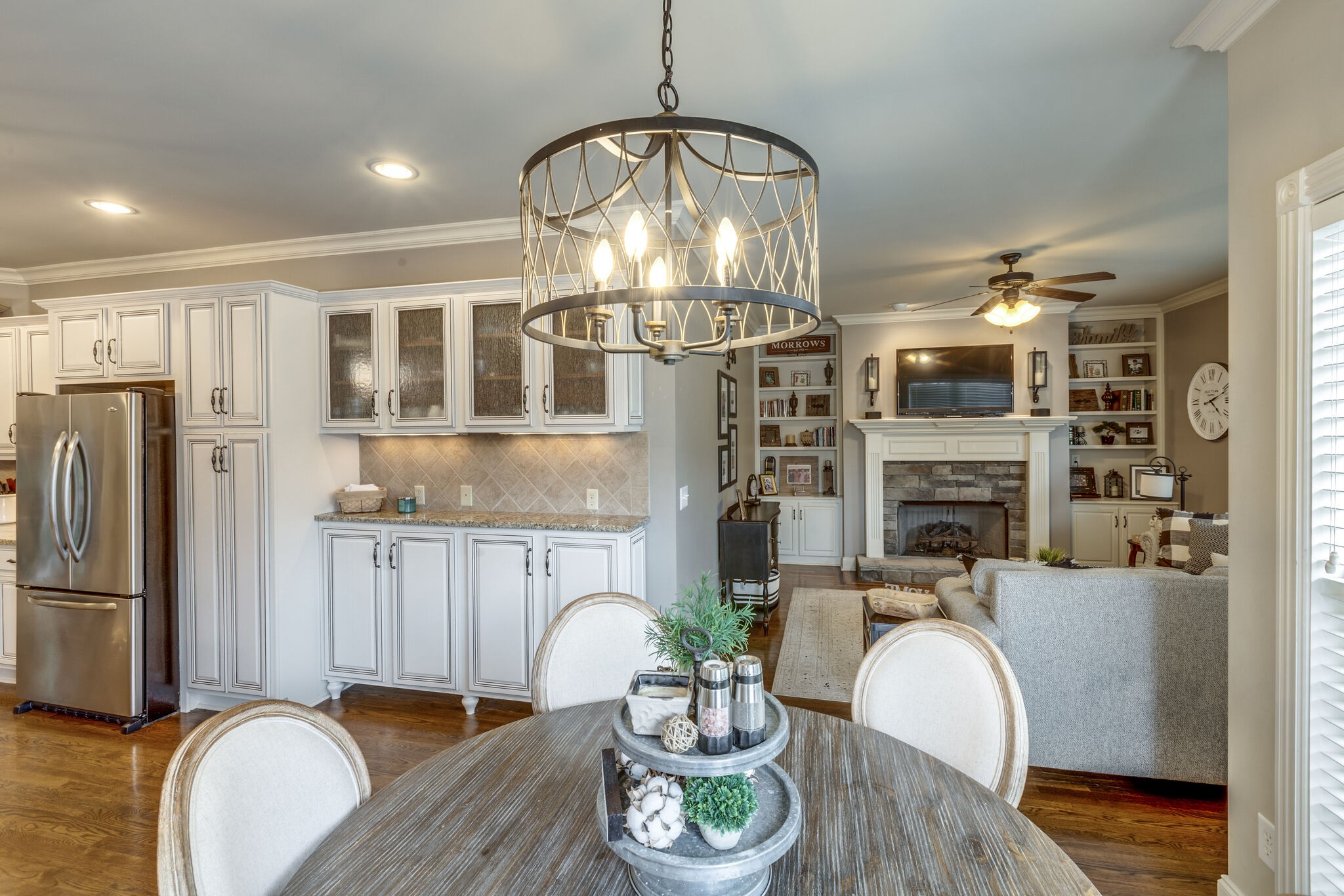 3012 Stewart Campbell Pointe Spring Hill, TN 37174 - Photo 18 of 44 a living room with fireplace furniture and a chandelier