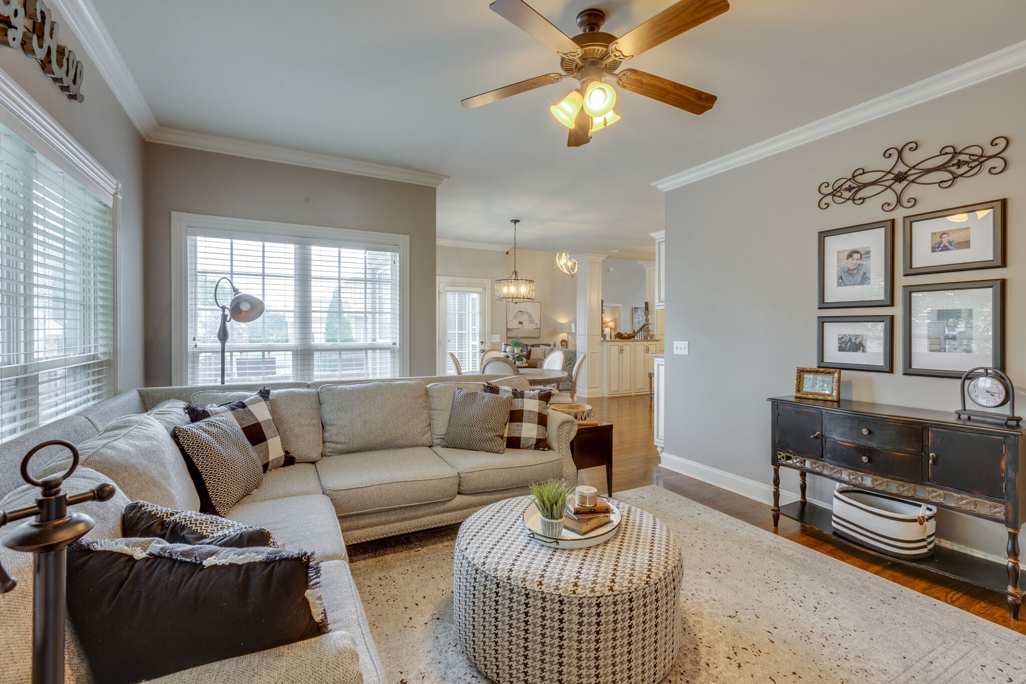 3012 Stewart Campbell Pointe Spring Hill, TN 37174 - Photo 20 of 44 a living room with furniture a flat screen tv and a window