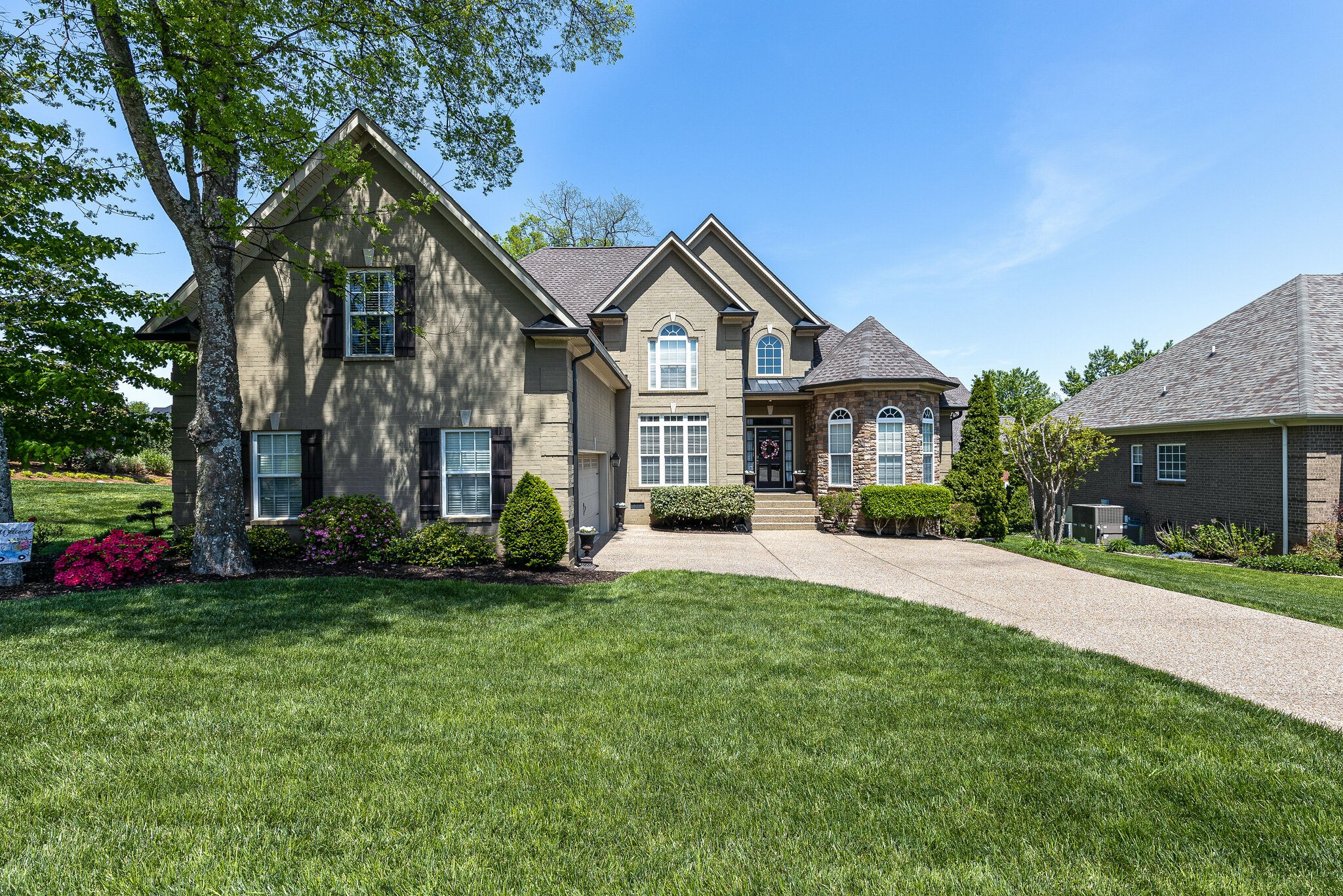 3012 Stewart Campbell Pointe Spring Hill, TN 37174 - Photo 2 of 44 a front view of a house with a yard and porch