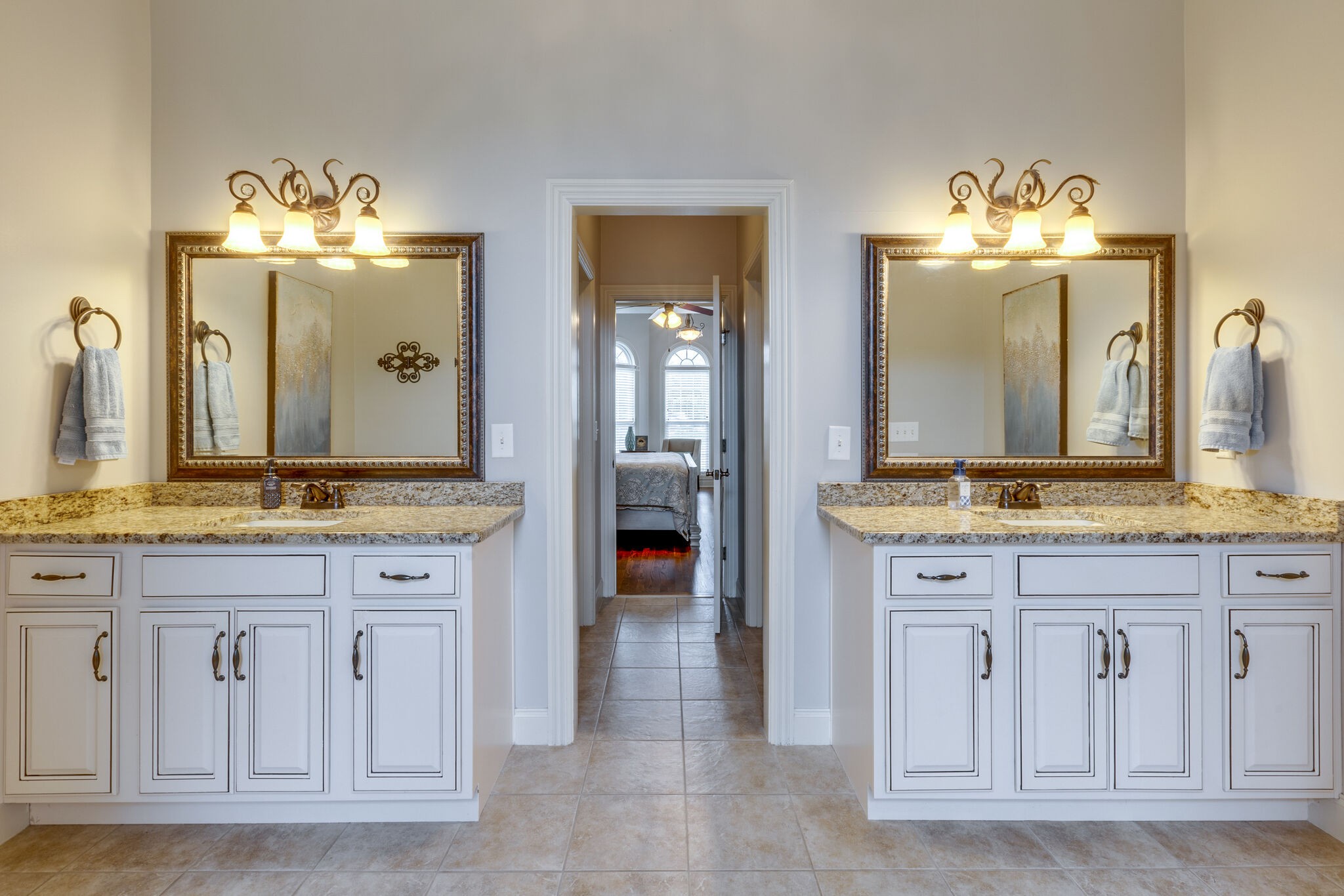 3012 Stewart Campbell Pointe Spring Hill, TN 37174 - Photo 23 of 44 a bathroom with a granite countertop sink and a mirror