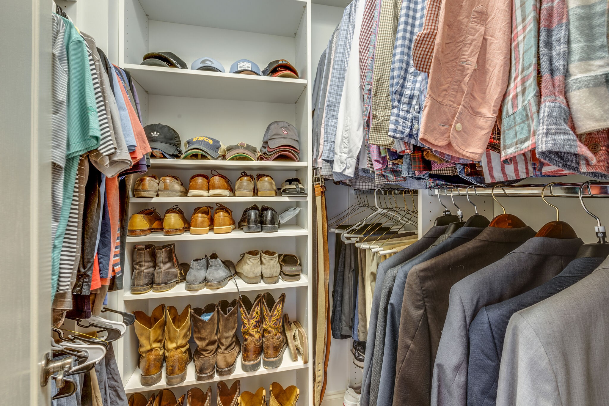 3012 Stewart Campbell Pointe Spring Hill, TN 37174 - Photo 25 of 44 a view of walk in closet with clothes and shoes