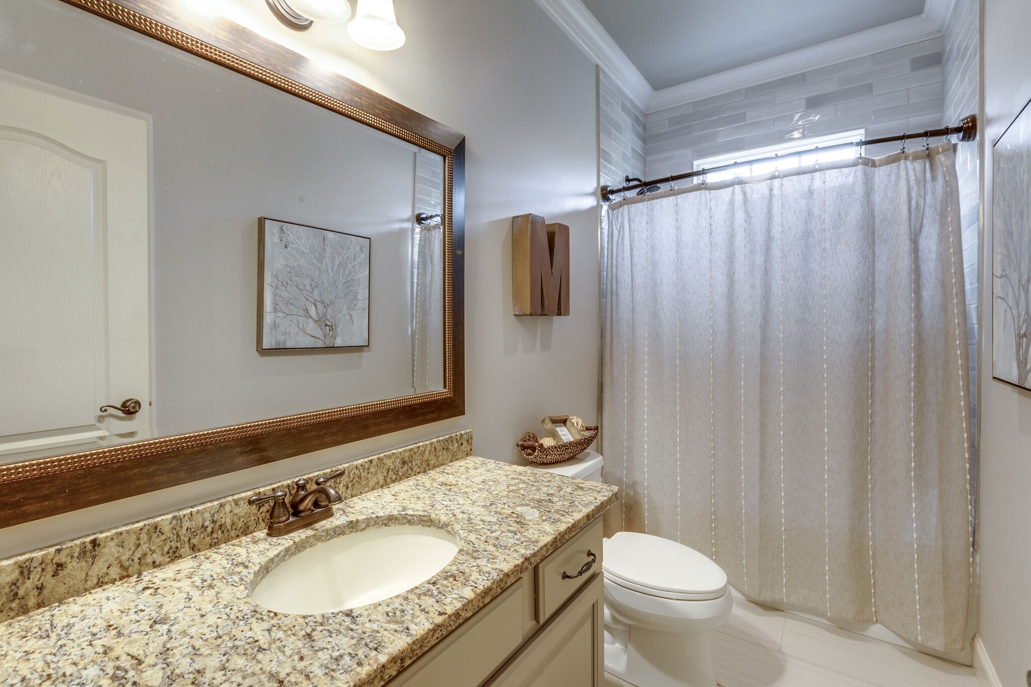 3012 Stewart Campbell Pointe Spring Hill, TN 37174 - Photo 28 of 44 a bathroom with a granite countertop sink toilet and shower