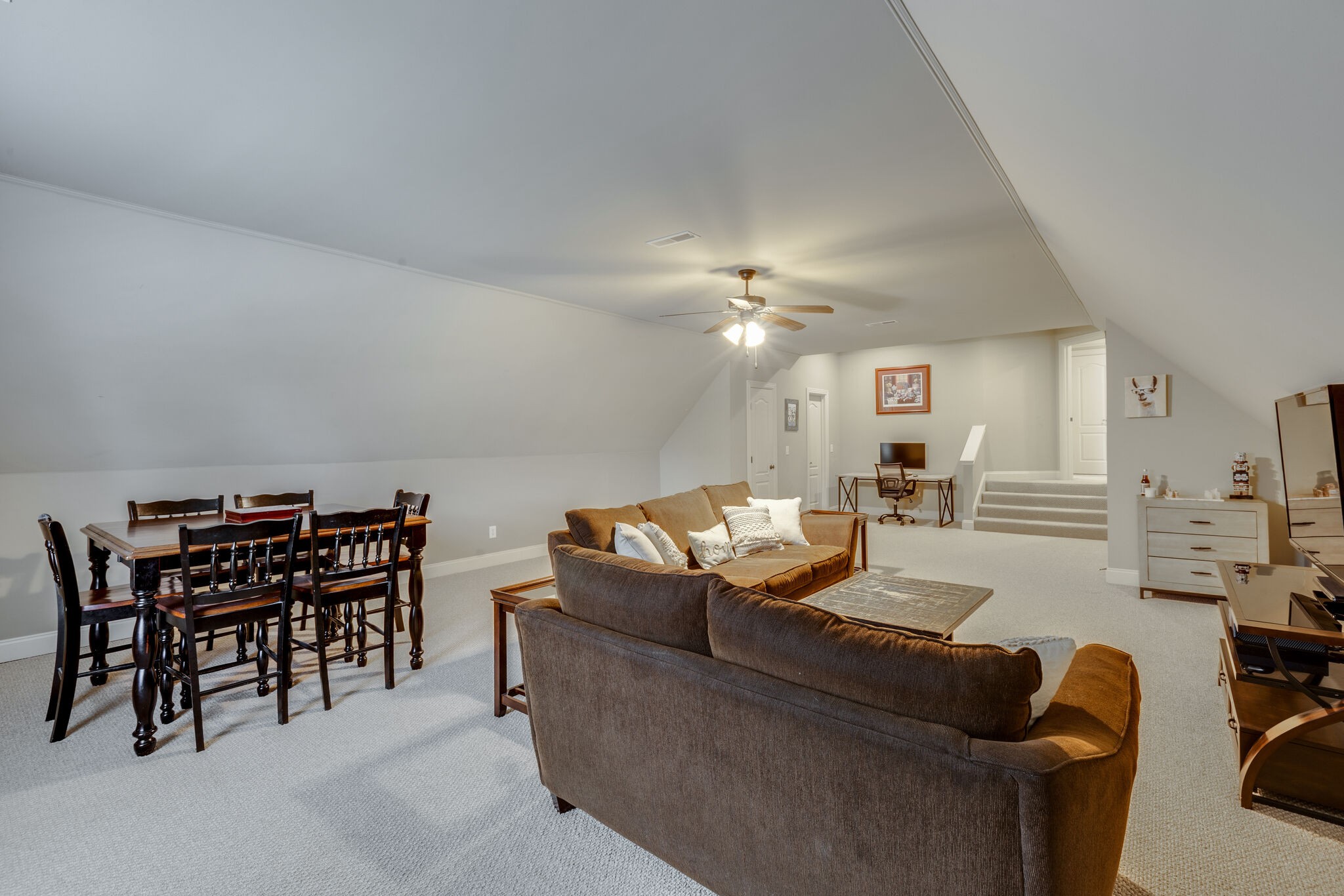 3012 Stewart Campbell Pointe Spring Hill, TN 37174 - Photo 34 of 44 a living room with furniture and a chandelier