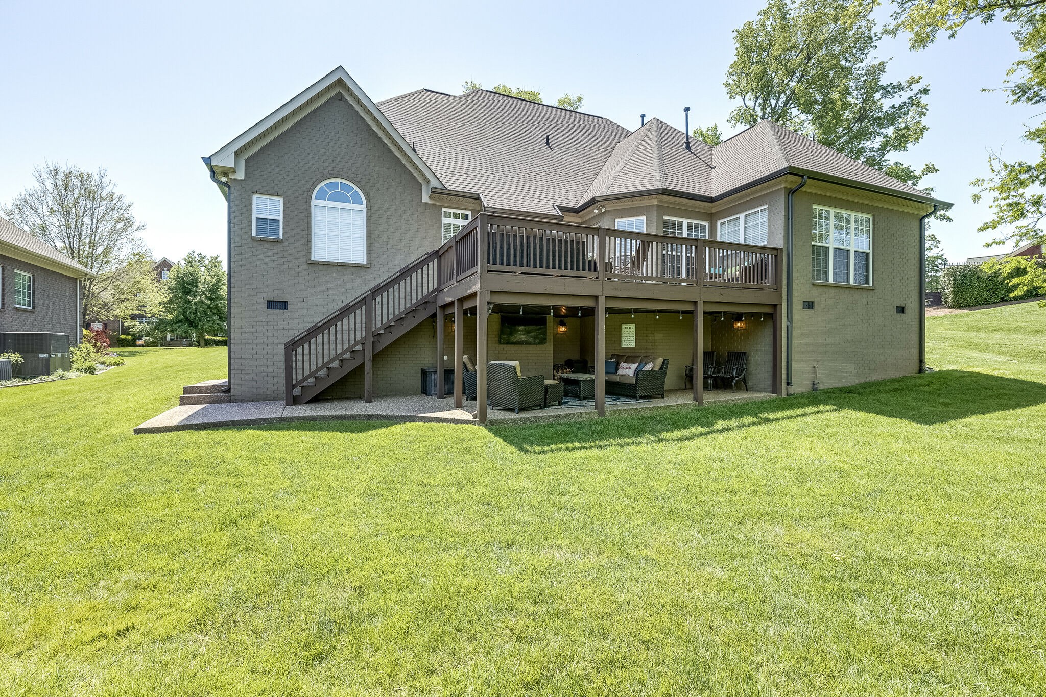 3012 Stewart Campbell Pointe Spring Hill, TN 37174 - Photo 42 of 44 a view of a house with a yard and large tree