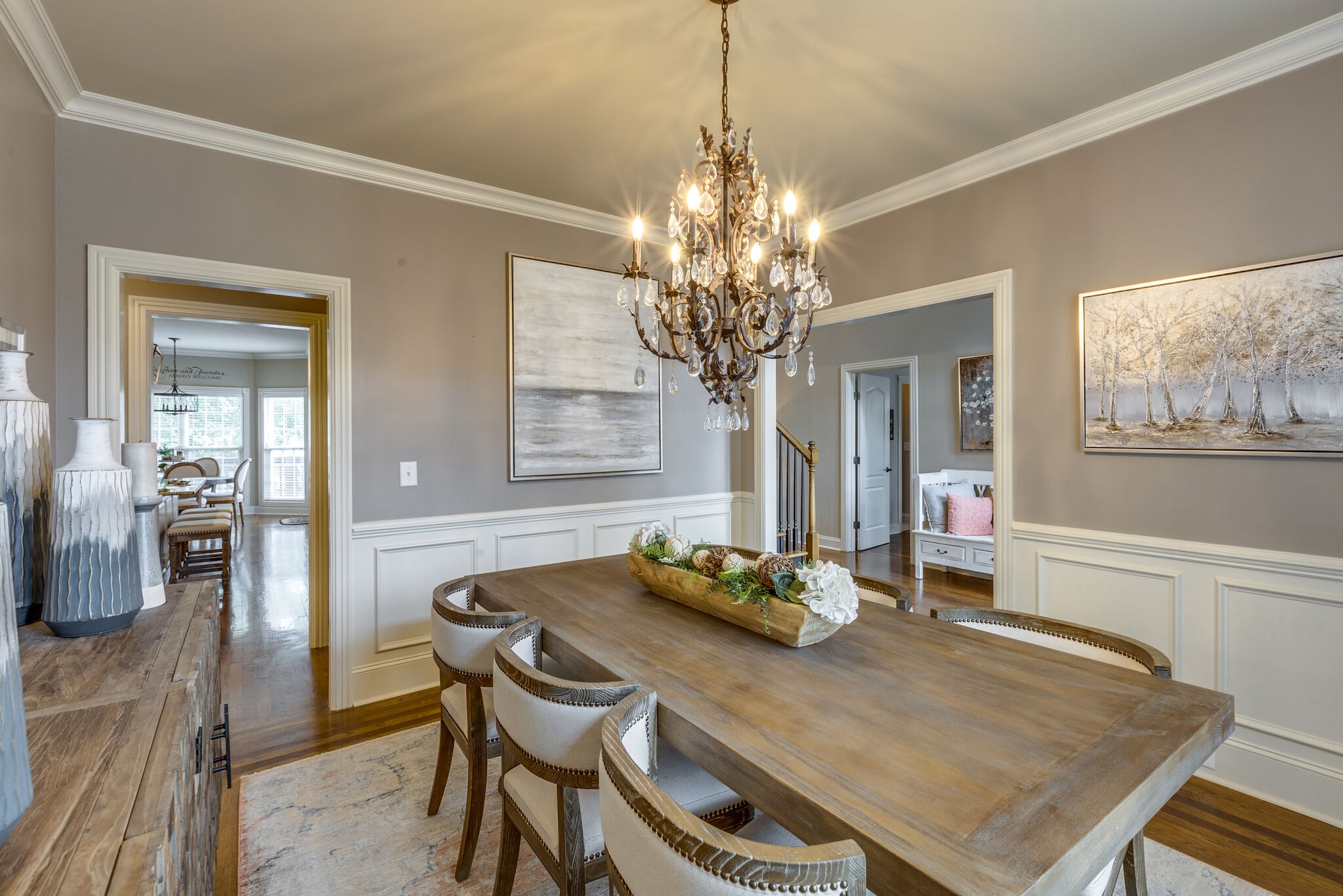 3012 Stewart Campbell Pointe Spring Hill, TN 37174 - Photo 7 of 44 a view of a dining room with furniture a chandelier and wooden floor