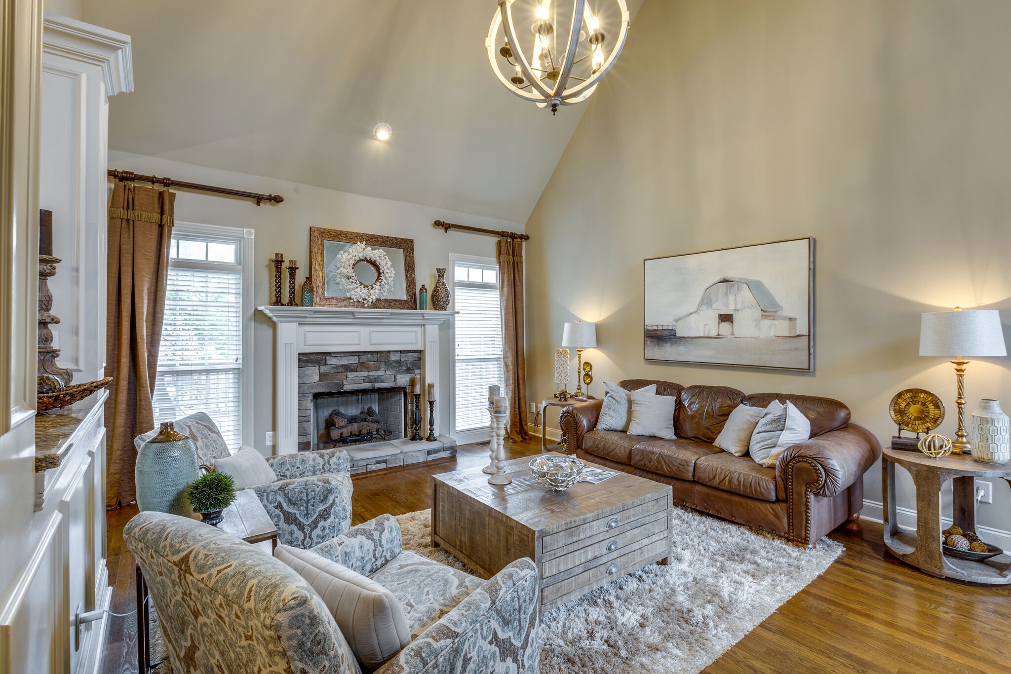 3012 Stewart Campbell Pointe Spring Hill, TN 37174 - Photo 9 of 44 a living room with furniture and a fireplace