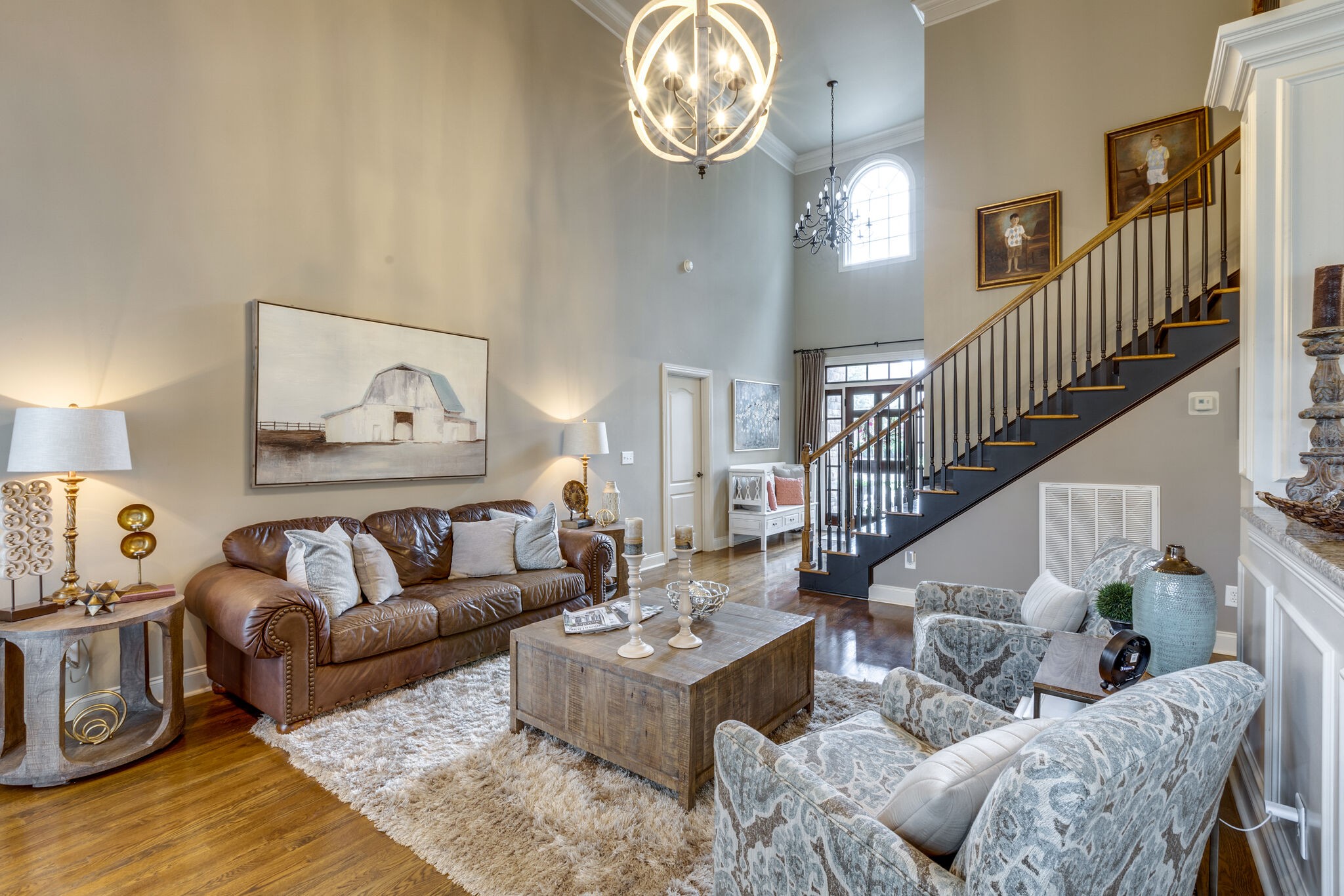 3012 Stewart Campbell Pointe Spring Hill, TN 37174 - Photo 10 of 44 a living room with furniture a rug and a wall painting