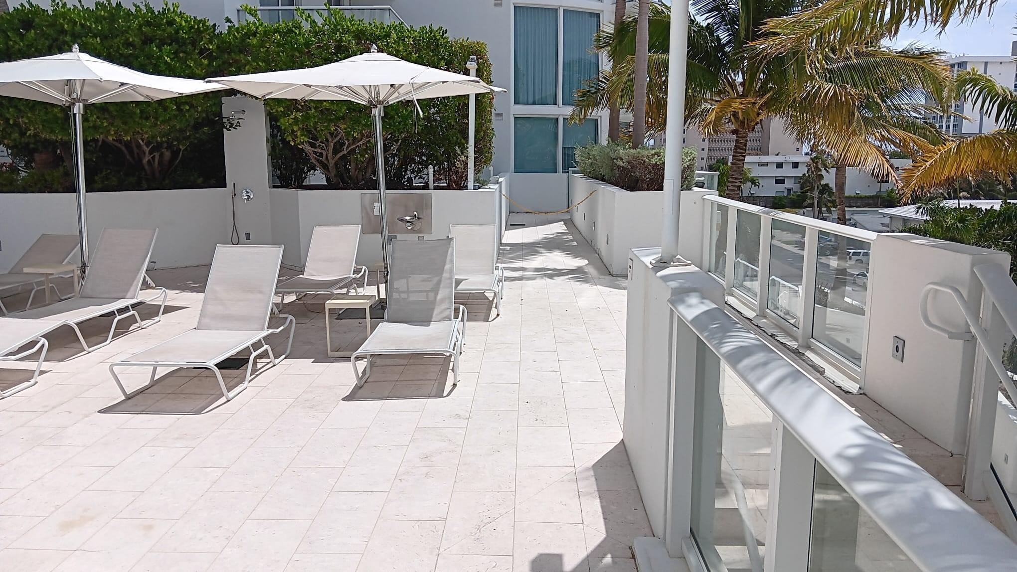 401 North Birch Road, Unit 401 Fort Lauderdale, FL 33304 - Photo 4 of 25 private walkway to pool