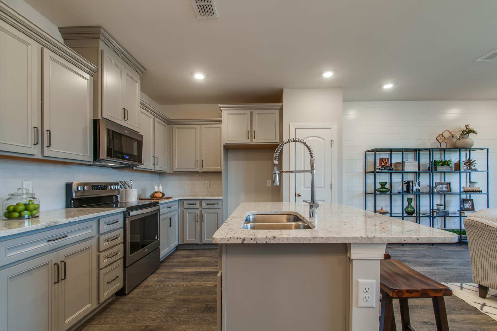3309 Deerchase Circle Murfreesboro, TN 37129 - Photo 7 of 27 a kitchen with stainless steel appliances granite countertop a sink a stove top oven a counter space and cabinets