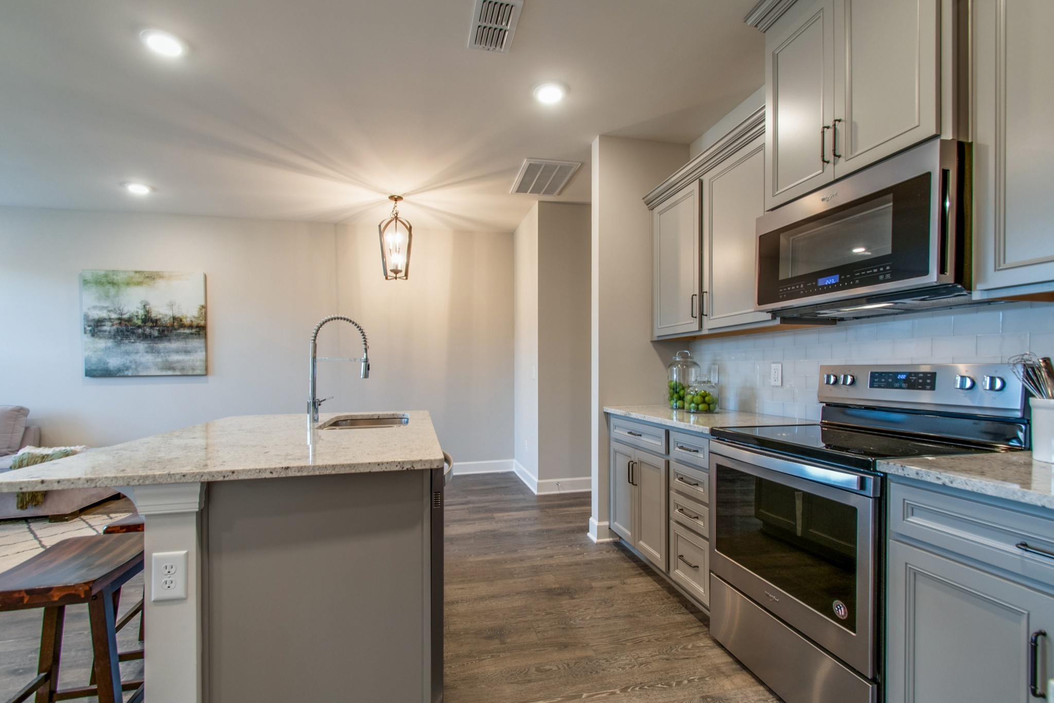 3309 Deerchase Circle Murfreesboro, TN 37129 - Photo 9 of 27 a kitchen with stainless steel appliances a stove a microwave a sink and cabinets