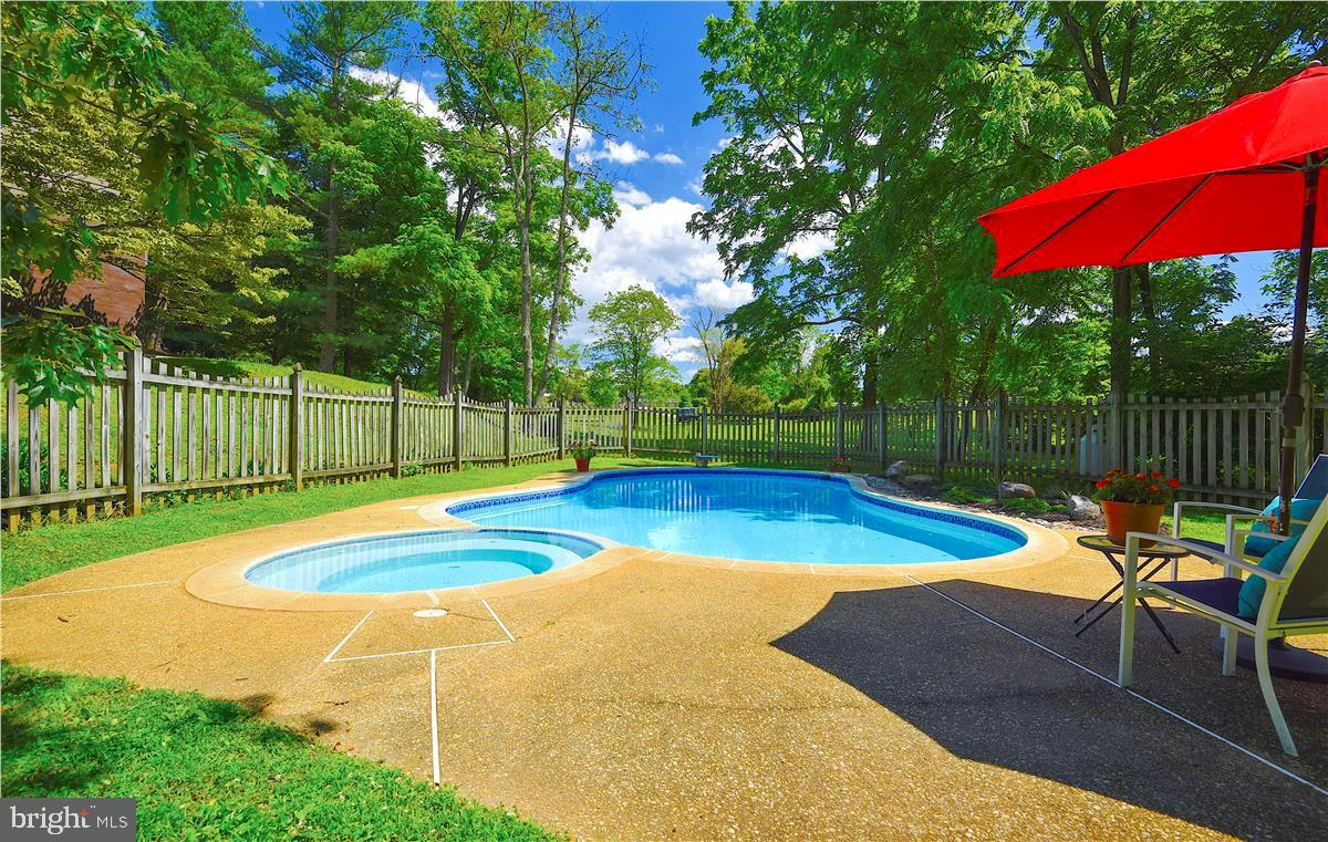 2224 Traceys Road Sparks, MD 21152 - Photo 14 of 53 a view of a swimming pool with a patio and a yard