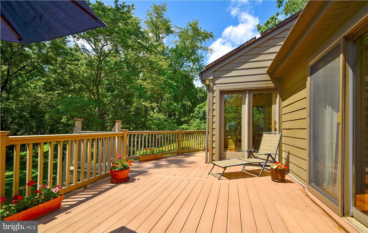 2224 Traceys Road Sparks, MD 21152 - Photo 50 of 53 a view of balcony with wooden floor and outdoor seating