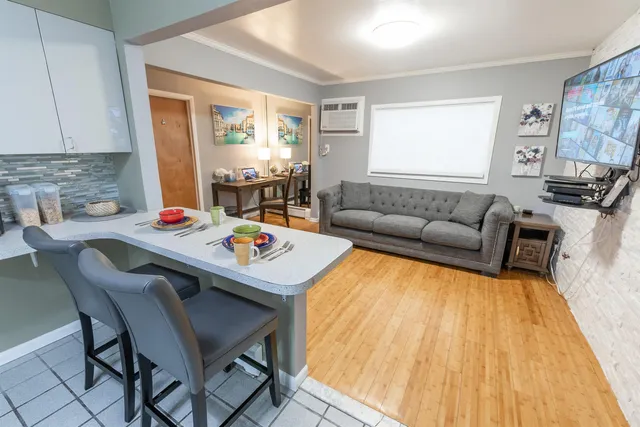 a living room with furniture and a table