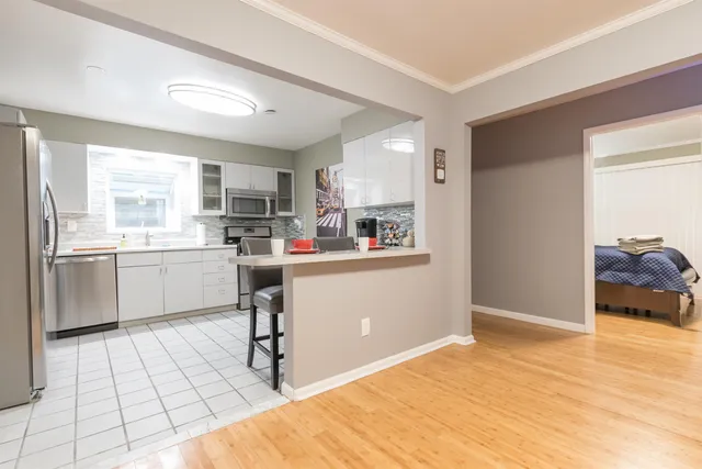 a kitchen with a sink cabinets and window